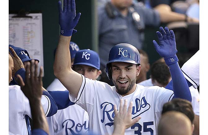 Kansas City Royals' Eric Hosmer celebrates in the dugout after hitting a solo home run during the fourth inning of a baseball game against the Pittsburgh Pirates Wednesday, July 22, 2015, in Kansas City, Mo.