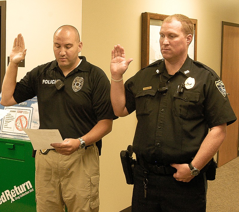 The swearing in of police officers Keith Strutton, left, and Jeff Fitzwater, brings the City of California Police Department to its full force of eight full-time police officers.