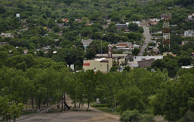 In this July 20, 2015 photo, vegetation surrounds the town of Badiraguato, Mexico. Drug lord Joaquin "El Chapo" Guzman's escape on July 11 from a prison near Mexico City has focused attention again on Badiraguato, the county seat of a township that includes the hamlet of La Tuna, where El Chapo's mother still lives.