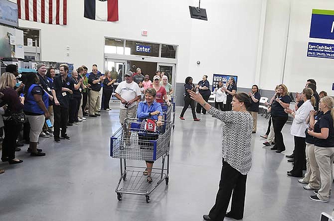 Sam's Club in Jefferson City is now open after celebrating their grand opening Thursday morning, July 23, 2015, with a ribbon cutting by the Chamber Ambassadors, music from the Jefferson City High School Drum Line and more. The first guests in the door were greeted by associates on both sides who formed an aisle to welcome them with a cheer.