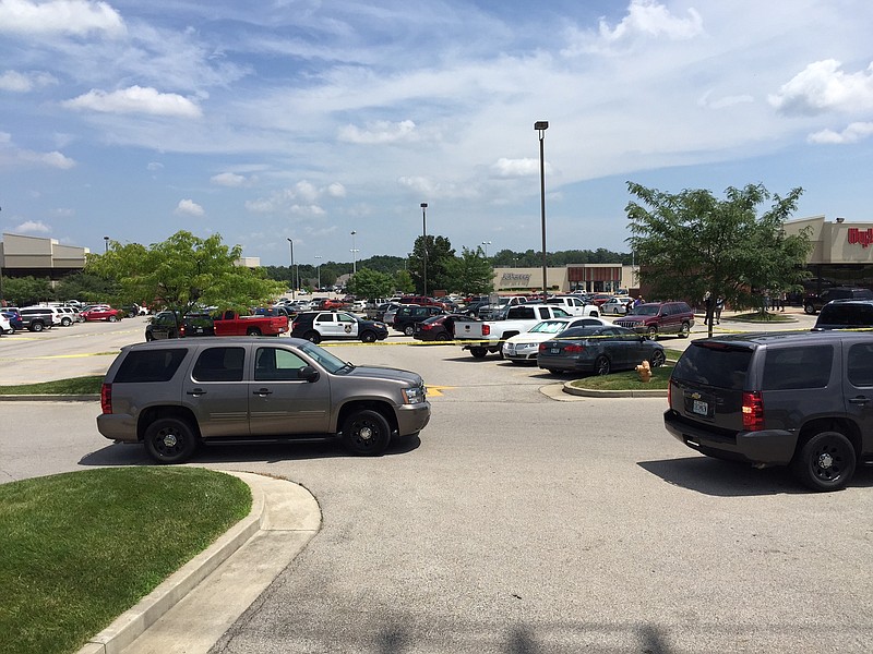 Jefferson City police place crime-scene tape around part of the Hy-Vee parking lot after responding to a shooting at 1:20 p.m Monday.