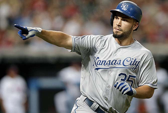 Kansas City Royals' Eric Hosmer points to the Royals dugout after hitting a solo home run off Cleveland Indians starting pitcher Trevor Bauer in the ninth inning of a baseball game, Tuesday, July 28, 2015, in Cleveland. 