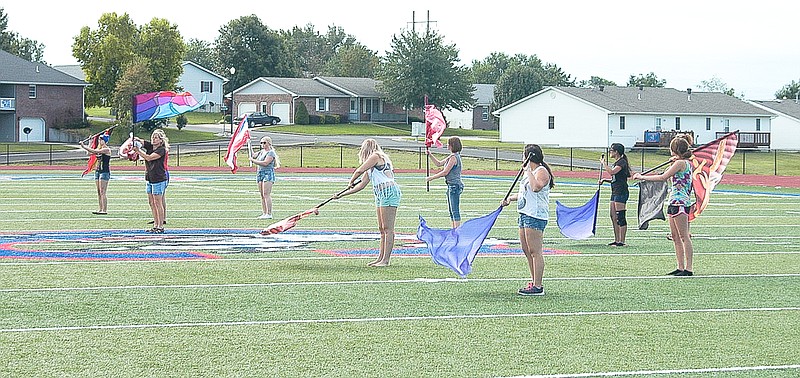 The California Pintos Flag Corps practices a routine with the CHS Band playing on Wednesday, July 22. Both camps were held in coordination.