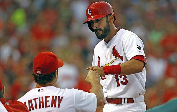 St. Louis Cardinals' Matt Carpenter is congratulated by manager Mike Matheny after hitting his second home run of the game during the fifth inning of a baseball game against the Colorado Rockies, Thursday, July 30, 2015, in St. Louis. 