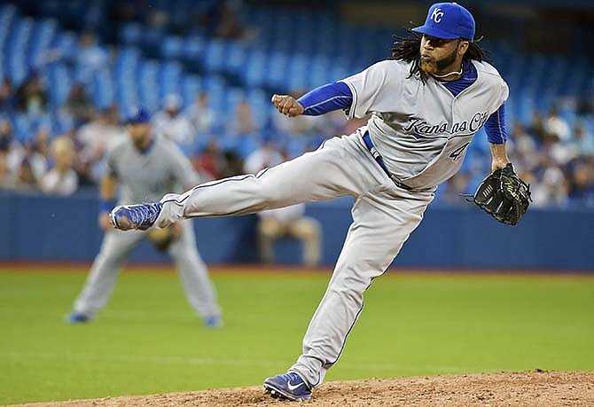Kansas City Royals starting pitcher Johnny Cueto works against the Toronto Blue Jays during the fifth inning of a baseball game, Friday, July 31, 2015 in Toronto. (Nathan Denette/The Canadian Press via AP)