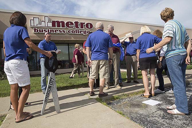 Members of the Jefferson City Area Chamber of Commerce enjoy the festivities at the Metro Business
College 30th Anniversary celebration after hosting a "Pride and Progress" ribbon cutting
to mark three decades of business for the school.