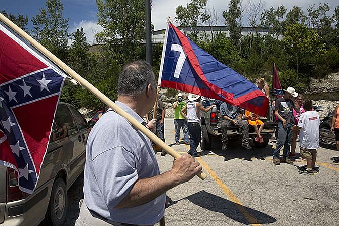 Fifteen protestors showed up Saturday at Walmart on Stadium Boulevard to show support for the Confederate flag and protest Walmart's decision to stop carrying all merchandise that displays the flag. The rally started at the Walmart in Fulton and made its way to Jefferson City.