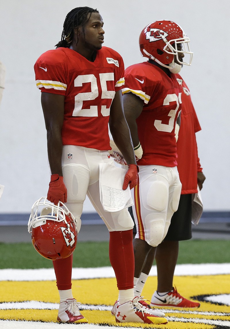 Chiefs running back Jamaal Charles (25) takes a break between plays Monday in St. Joseph.