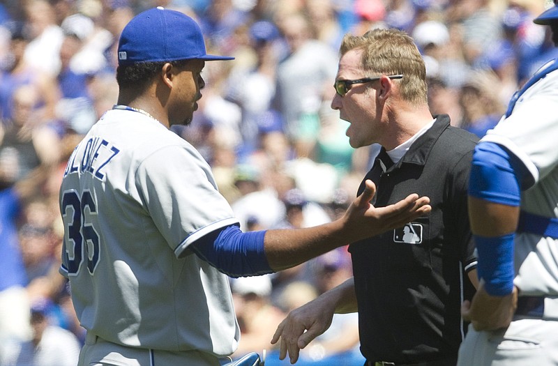 Royals starting pitcher Edinson Volquez is given a warning by home plate umpire Jim Wolf after brushing back Josh Donaldson of the Blue Jays with a pitch during the third inning of Sunday's game in Toronto.