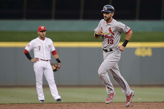 St. Louis Cardinals' Matt Carpenter rounds the bases after hitting a two-run home run off Cincinnati Reds starting pitcher Anthony DeSclafani during the third inning of a baseball game, Tuesday, Aug. 4, 2015, in Cincinnati.