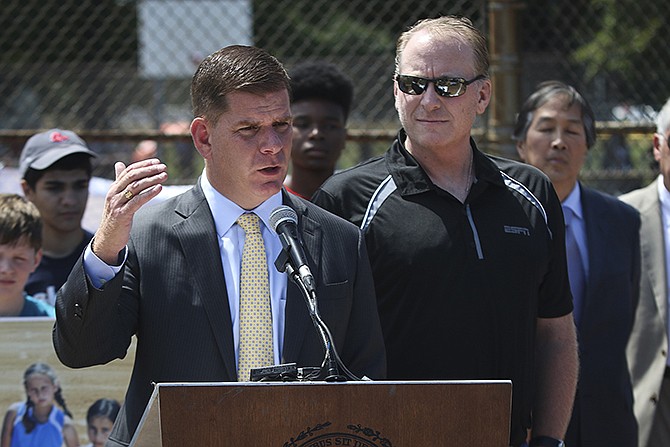Boston Mayor Martin J. Walsh, joined by former Boston Red Sox pitcher Curt Schilling, speaks Wednesday during a press conference about his proposal to ban snuff and chewing tobacco in city ballfields, including Fenway Park. 