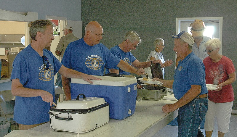 Kiwanis members serving at the breakfast in Centennial Hall at the Moniteau County Fairgrounds are, from near left, are Jeff Schackleford, Kiwanis President Bobby Roll, and Harry Minturn.