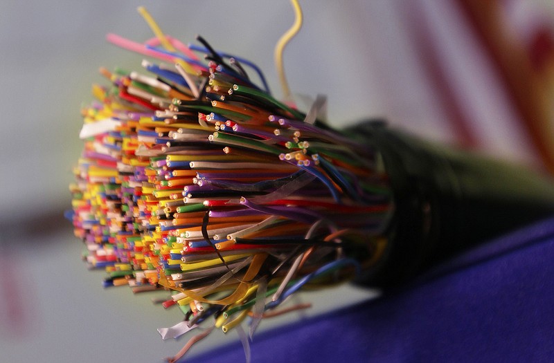 A bundle of insulated copper telephone cables is displayed during a news conference on copper and metal theft, at the Arkansas state Capitol in Little Rock, Ark. Today, the Federal Communications Commission is expected to require that phone companies warn residential customers three months before they abandon a copper network. For businesses, six months notice would be required.