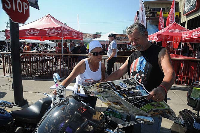 Sandy Swezy, left, and Tim Swezy, right, traveled from Illinois to attend Sturgis and have explored the Black Hills area. Tim Swezy said on Wednesday, Aug. 5, 2015, in Sturgis, S.D., that it's been on his "bucket list" to attend the motorcycle rally. 