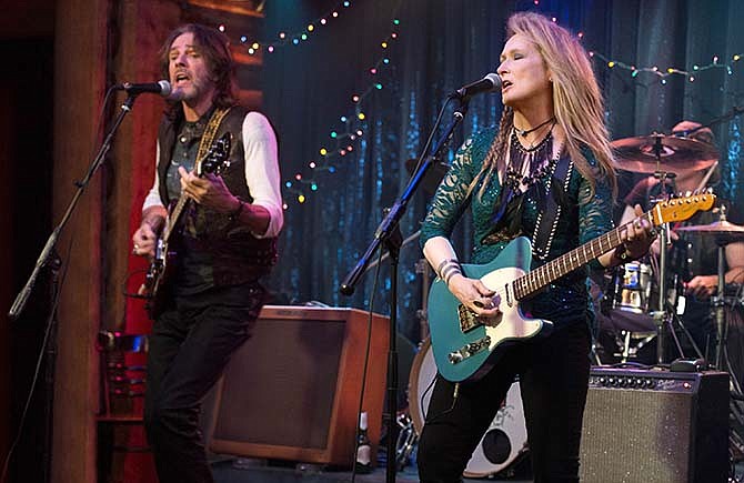 This photo provided by courtesy of Sony Pictures shows, Rick Springfield, left, as Greg and Meryl Streep, as Ricki, performing at the Flash at the Salt Well in TriStar Pictures' "Ricki and the Flash." The movie opens in U.S. theaters on Aug. 7, 2015. 