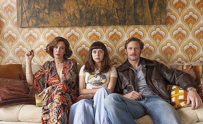 This photo provided by Sony Pictures Classics shows, Kristen Wiig, from left, as Charlotte Goetze, Bel Powley as Minnie Goetze and Alexander Skarsgard as Monroe, in a scene from the film, "The Diary of a Teenage Girl." The movie releases in U.S. theaters on Aug. 7, 2015.