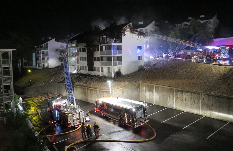 Firefighters continue to extinguish a fire that took the lives of four children Tuesday night at an Osage Beach condominium unit.