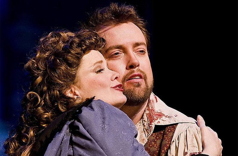 Jefferson City native Suzanne Wood and her husband John Pickle sing in an earlier performance