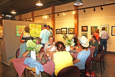 Local artists and enthusiasts gathered at the Art House for a reception for its end of summer art exhibit "Dog Days of Summer" Thursday evening in downtown Fulton. The reception featured over 95 pieces of artwork from 31 artists. 