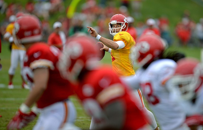 Chiefs quarterback Alex Smith prepares to make a throw during training camp Saturday in St. Joseph.