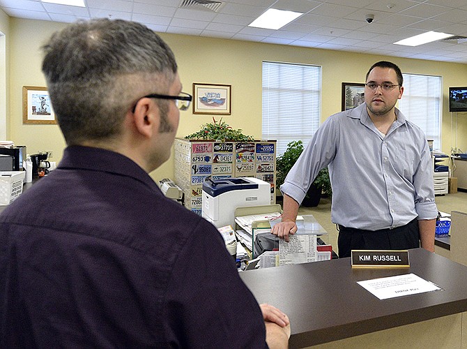 Rowan County clerk Nathan Davis, right, informs David Moore Thursday that the clerk's office will not be issuing marriage licenses to same-sex couples, in defiance of an order from a federal judge in Morehead, Kentucky.