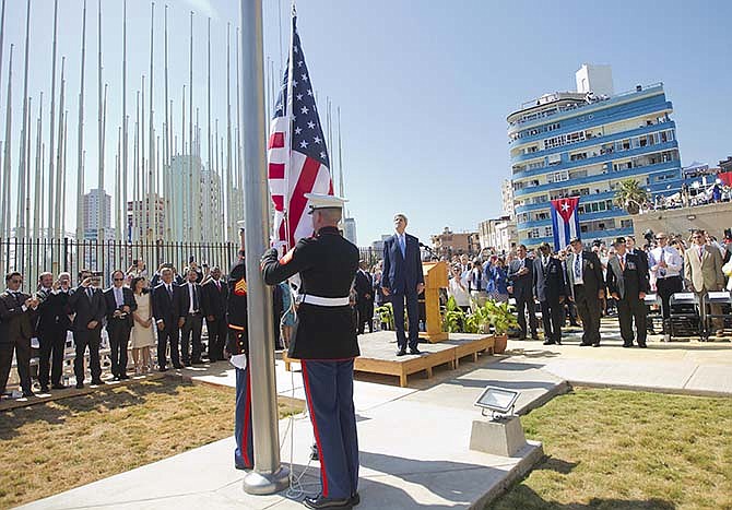 Secretary of State John Kerry, and other dignitaries watch as U.S. Marines raise the U.S. flag over the newly reopened embassy in Havana, Cuba. Friday, Aug. 14, 2015. Kerry traveled to the Cuban capital to raise the U.S. flag and formally reopen the long-closed U.S. Embassy. Cuba and U.S. officially restored diplomatic relations July 20, as part of efforts to normalize ties between the former Cold War foes. 
