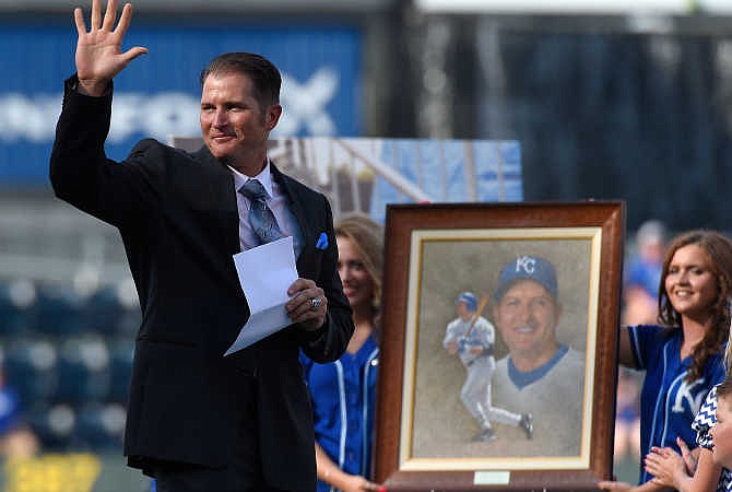 Kansas City Royals Hall of Fame member Mike Sweeney waves during Saturday's induction ceremony to the team's Hall of Fame, Saturday, Aug. 15, 2015, at Kauffman Stadium in Kansas City, Mo. 