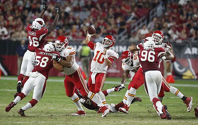 Kansas City Chiefs quarterback Chase Daniel (10) throws under pressure from the Arizona Cardinals during the second half of an NFL preseason football game, Saturday, Aug. 15, 2015, in Glendale, Ariz.