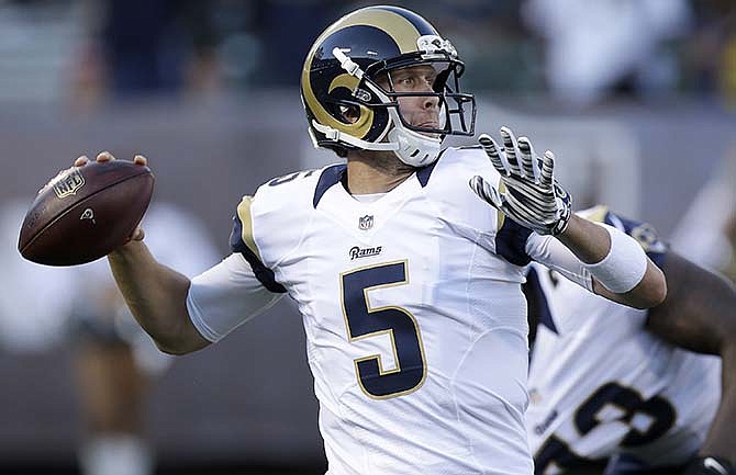 St. Louis Rams quarterback Nick Foles (5) passes against the Oakland Raiders during the first half of an NFL preseason football game in Oakland, Calif., Friday, Aug. 14, 2015. 