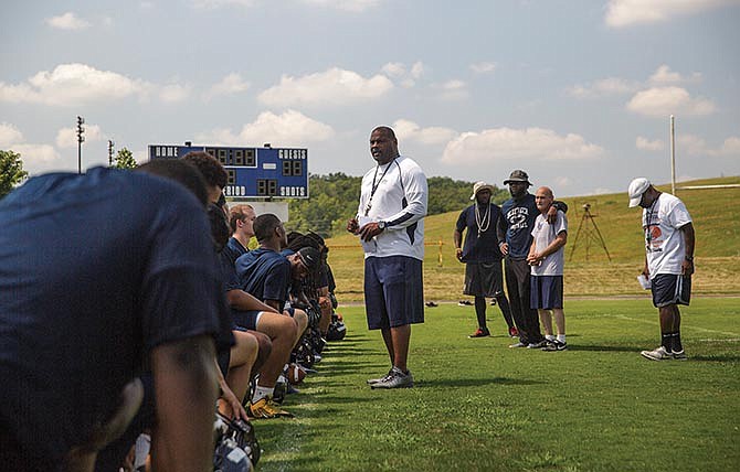 Lincoln University head coach Mike Jones addresses his football team following the first practice of the season Saturday on the Jefferson City campus.