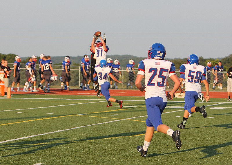 Kyle Hofstetter interceptions a pass against Owensville during the first game in Friday night's jamboree.