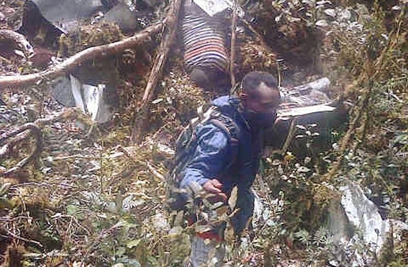 Plane wreckage is strewn across dense terrain Tuesday in Pegunungan Bintang, Papua province, Indonesia.