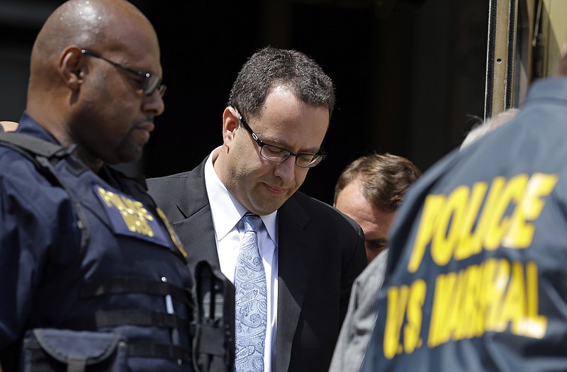 Former Subway pitchman Jared Fogle leaves the Federal Courthouse in Indianapolis on Wednesday, following a hearing on child-pornography charges. Fogle agreed to plead guilty to allegations he paid for sex acts with minors and received child pornography in a case that destroyed his career at the sandwich-shop chain and could send him to prison for more than a decade.