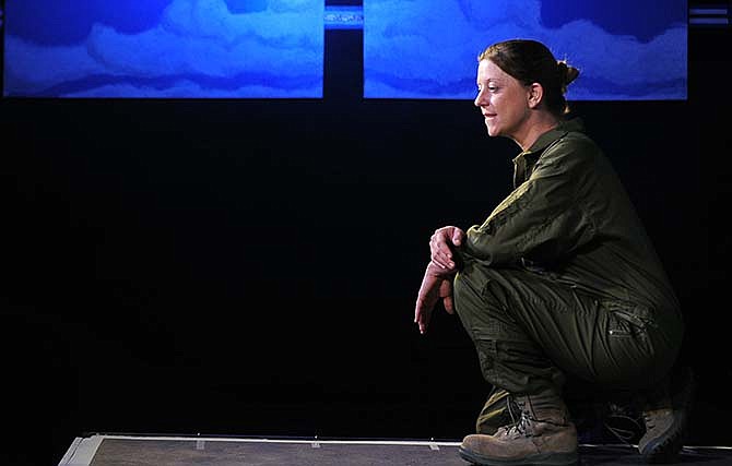 Megan Wadley plays the role of a U.S. Air Force pilot during a rehearsal for Scene One Theatre's upcoming production of "Grounded."