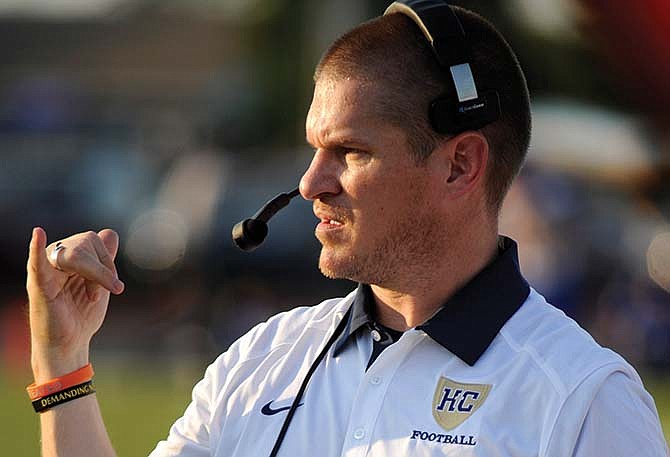 Helias head coach Tim Rulo singals from the sideline during last Friday night's Jamboree in Wardsville.