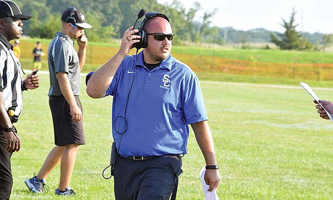 South Callaway head coach Zack Hess looks toward the field during the Jamboree at Father Tolton in Columbia, Mo.