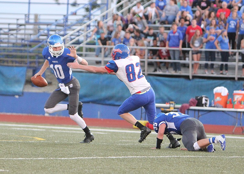 Kale McAdams, No. 82, fights off a Boonville blocker in an attempt to sack quarterback Nick Zeitlow during California's 9-6 loss to the Pirates Friday night.