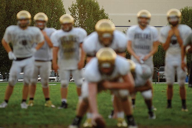 The Helias Crusaders work during a recent practice at the school's practice field.