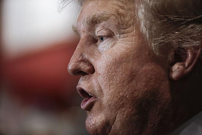 Republican presidential candidate Donald Trump answers questions with reporters after speaking at the National Federation of Republican Assemblies on Saturday, Aug. 29, 2015, in Nashville, Tenn.