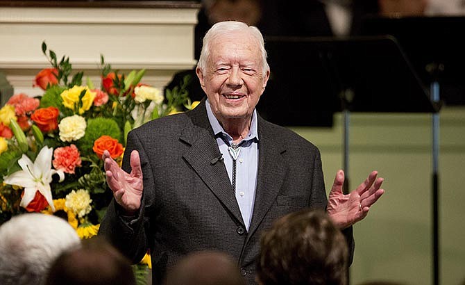 In this Aug. 23, 2015 file photo, former President Jimmy Carter teaches Sunday School class at Maranatha Baptist Church in his hometown in Plains, Ga. Carter's recent diagnosis that cancer has spread to his brain will require him to scale back his work, but Carter Center officials say their programs will continue uninterrupted.