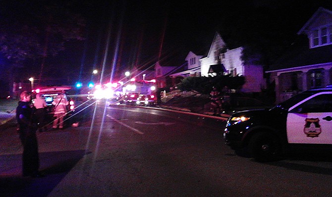 The 1200 block of East McCarty Street is blocked early Sunday morning as Jefferson City firefighters battle a blaze in a two-story house.