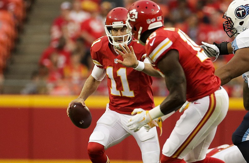 Chiefs quarterback Alex Smith prepares to throw to wide receiver Jeremy Maclin during the first half of Friday night's preseason game against the Titans at Arrowhead Stadium.