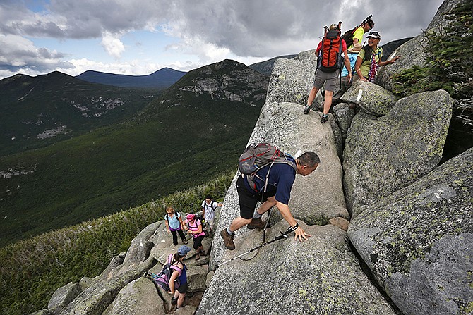 Day-hikers scramble over rocky boulders on the Appalachian Trail below the summit of Mt. Katahdin in Baxter State Park in Maine. The sharp rise in the number people using the Appalachian Trail is causing headaches for officials, who say they're dealing with increasing problems along the 2,189-mile footpath.