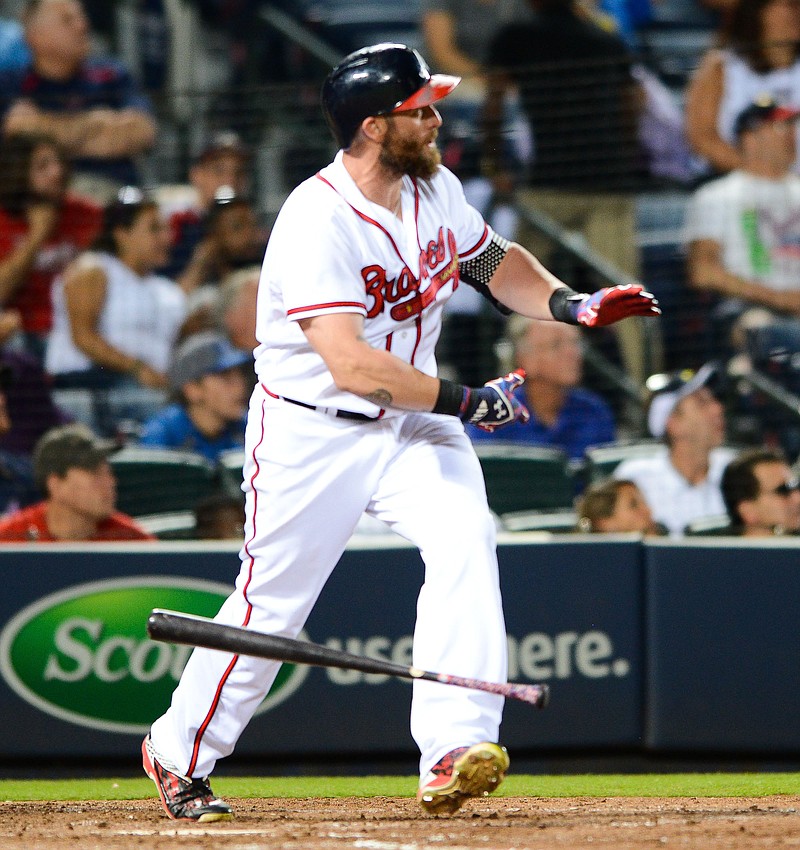 Jonny Gomes watches his solo home run while a member of the Braves during a game last week against the Rockies in Atlanta.