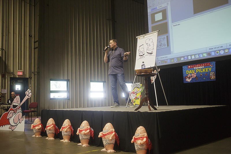 Author Dav Pilkey speaks to a crowd at Scholastic Inc. Tuesday after the release of his newest book, "Captain Underpants and the Sensational Saga of Sir Stinks-A-Lot." Pilkey has been writing and illustrating the "Captain Underpants" series since second grade.