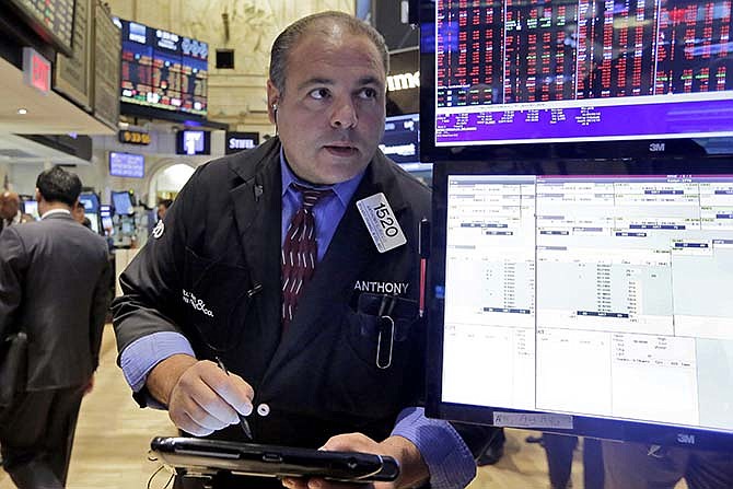 Trader Anthony Riccio works on the floor of the New York Stock Exchange, Tuesday, Sept. 1, 2015. More signs of weakness in China's economy are sending global stock markets sharply lower. 