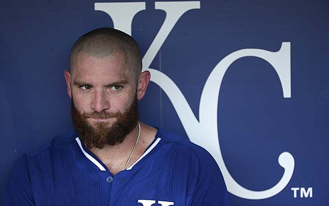 Kansas City Royals' Jonny Gomes sits in the dugout before a baseball game against the Detroit Tigers Tuesday, Sept. 1, 2015, in Kansas City, Mo. 