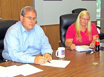 In this file photo from an August 28 interview, Fulton City Administrator William "Bill" Johnson (left) emphasizes a data point on one of several salary-related documents he and Human Resource Director Michelle Maupin presented in a press interview. 