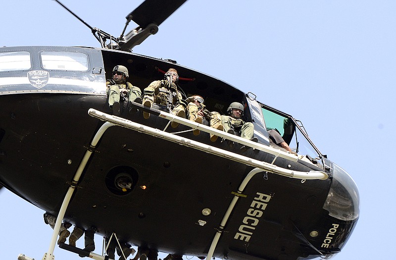 Police search from a helicopter for suspects in the shooting of a police officer in Fox Lake, Illinois. 