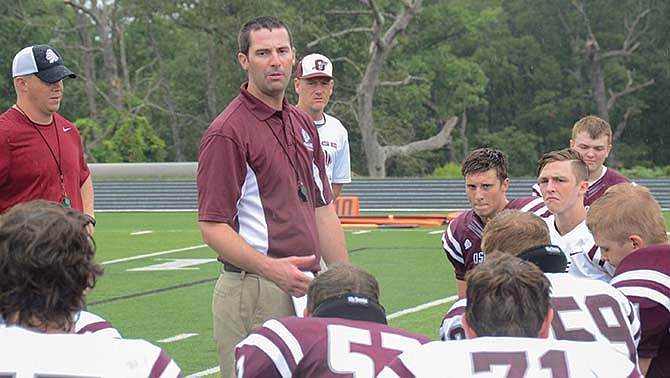 School of the Osage head coach Devin Johnson talks to his team last month. Johnson and the Indians are looking to use last week's win against Moberly as a springborard tonight against Warsaw.